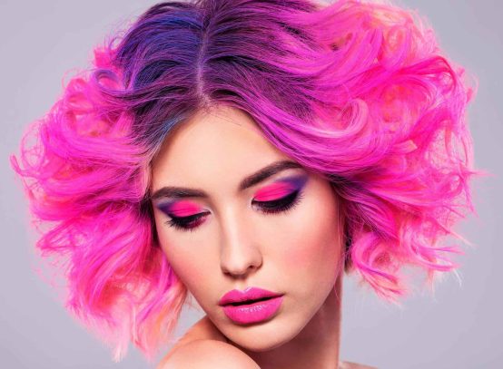 portrait-of-beautiful-young-woman-with-bright-pink-BF686FY-scaled.jpg
